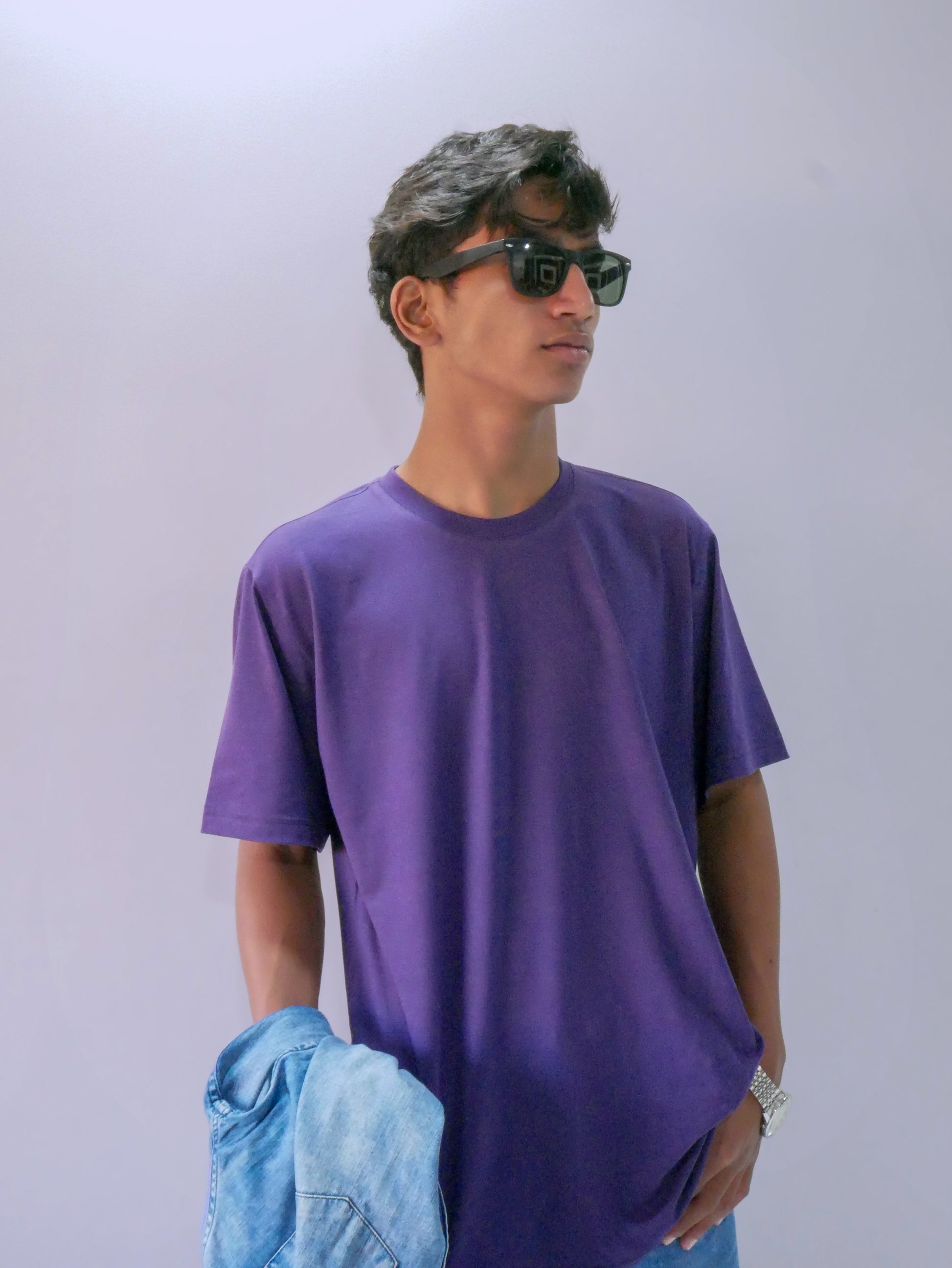 Model in premium purple bamboo T-shirt by THYVIBE, eco-friendly and breathable.
